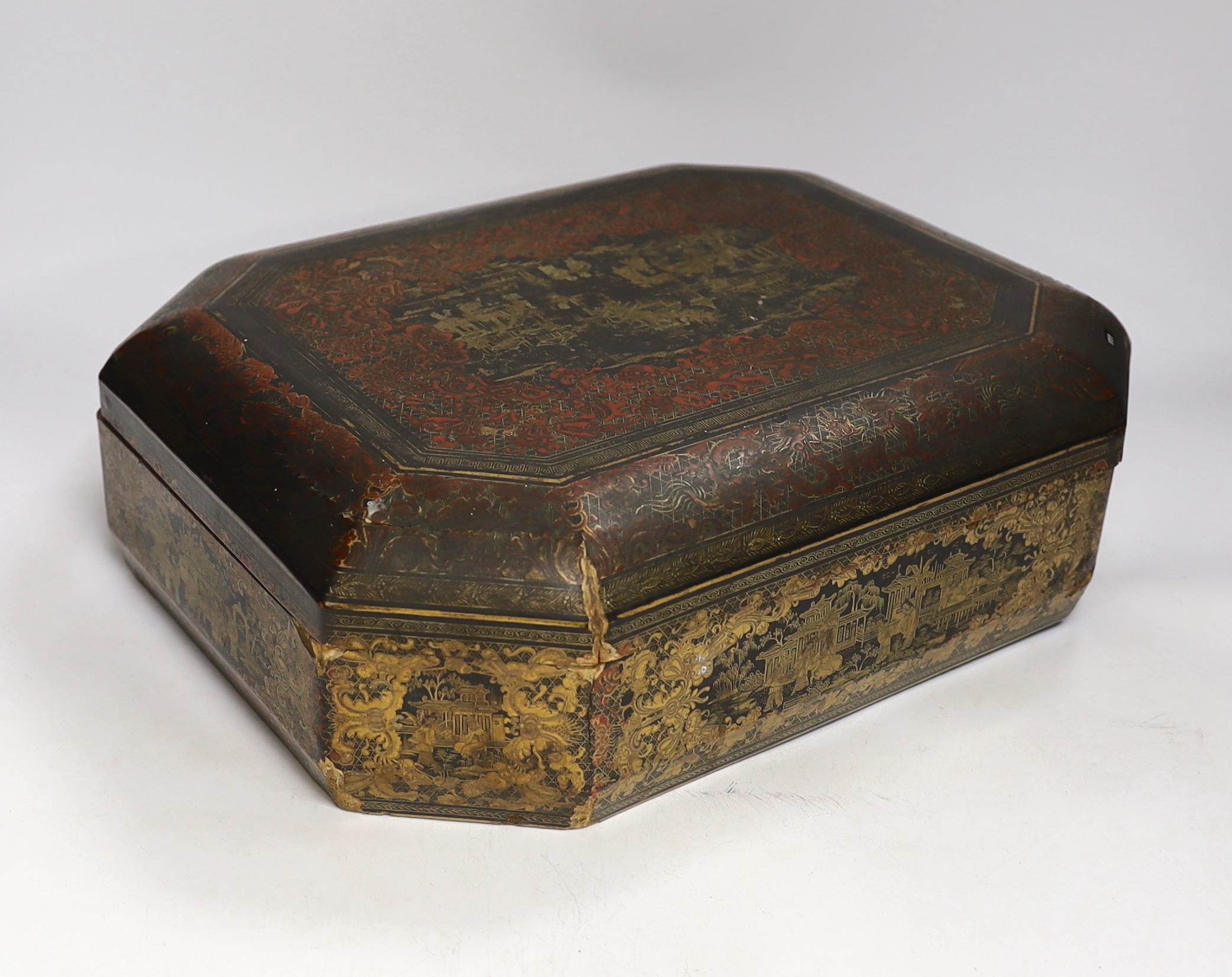 A mid 19th century Chinese gilt-decorated black lacquer games box containing mother-of-pearl counters